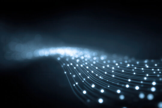 Abstract glowing lines and dots create futuristic digital wave pattern, representing data flow, technology, and connectivity in dark background, evoking innovation and progress