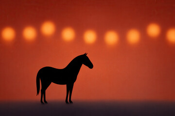 Silhouette horse orange background glowing bokeh lights minimalistic style peaceful mood animal standing side view creative concept dreamy atmosphere