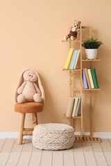 Naklejka premium Interior of children's room with bookshelf, toys and poufs