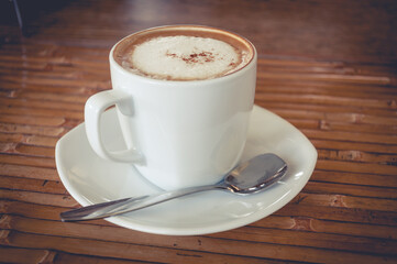 A cup of coffee with vintage filter