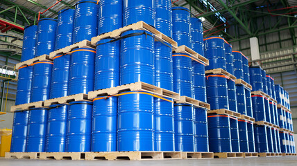 chemical barrels on wooden pallets, organized warehouse storage, industrial drums ready, safe chemical handling, shipment preparation