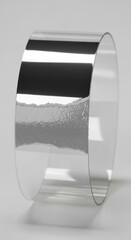 Reflective Silver Bangle: A minimalist abstract with polished elegance and textured element
