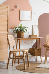 Interior of room with wicker chair and table