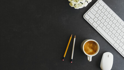 Modern Dark Black Office Desk Workspace with Computer Keyboard Coffee and Copy Space Top View. 3d...