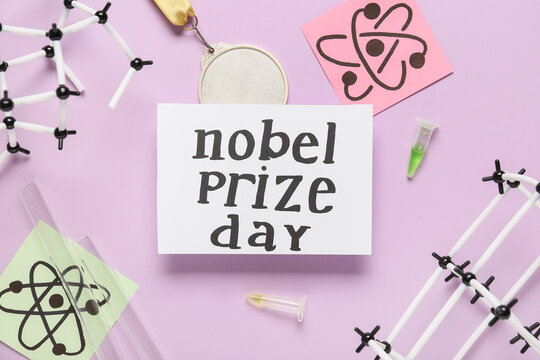 Paper with text NOBEL PRIZE DAY, molecular models, drawn molecules and medal on purple background