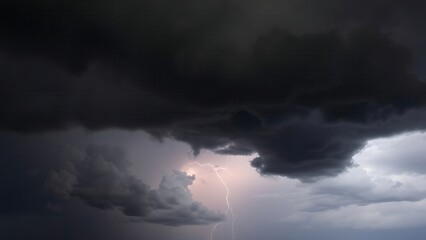  Dark storm clouds gathering before a storm, dramatic sky with distant lightning. 