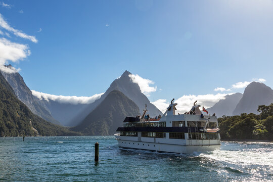 Passenger ship cruising at Milford Sound, New Zealand