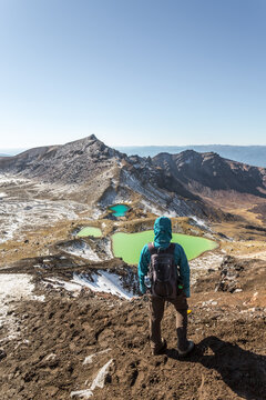 Woman hiking near emerald lakes, Tongariro National Park, New Zealand