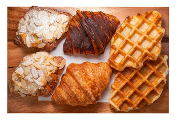 Freshly baked Waffle and Croissants in wooden plate isolated on white background, Croissants and Waffle on brown wooden plate on White Background PNG File.