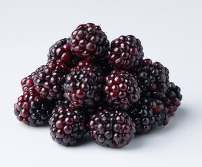 Dark, plump blackberries clustered together