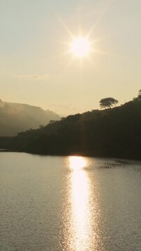 Vertical View Of Sunset Light Reflected Over Reservoir Of Presa EL Carrizo In Tamazula de Gordiano, Jalisco, Mexico. Aerial Shot