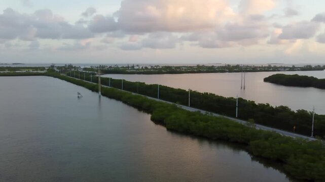 Panoramic aerial view of sunrise over Sand Point, Fleming Key, Dredgers Key, and Garrison Bight Mooring Field in Key West, Florida, showcasing wide coastal scenery from above.