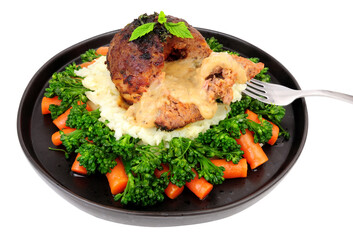 Lamb bomb meat ball meal with peppercorn sauce, mashed potato, carrots and broccoli isolated on a white background