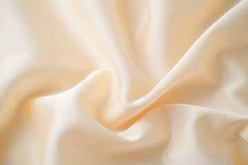 Cream fabric texture close up with soft folds and delicate light creating a smooth surface