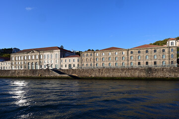 Obraz premium Alfandega Building, formerly New Customs House, on Douro River in Porto, Portugal on clear sunny September afternoon.