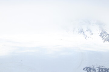 Mount Elbrus in the clouds on a summer day