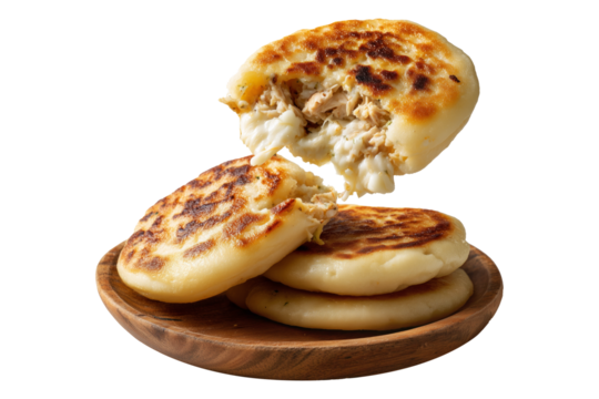 Grilled arepas plain sandwich filled with melted cheese and ground beef on wooden plate, isolated on white transparent background, concept of Latin street food