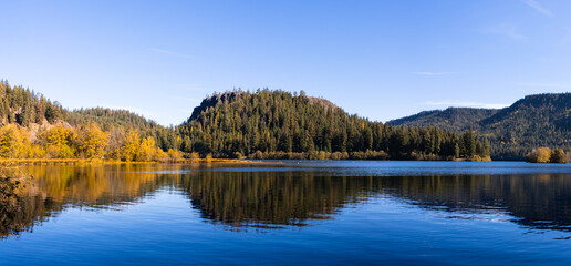 Panoramic view of Clear lake landscape in Mount Rainier national park with perfect reflections in autumn time.