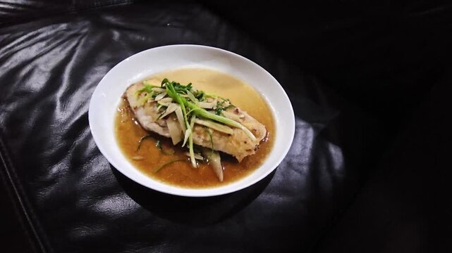 hot and sour soup,Tim Ikan,Steamed snapper fish with soybean sauce in a plate,Fish in soysauce