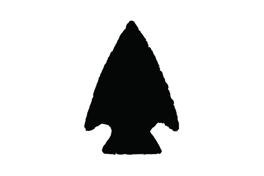 Black silhouette of ancient stone arrowhead with rough texture detail