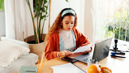 Reading, paper or university student in house with laptop, e learning or research for online project. College, tech or woman in home with document, test preparation or draft review for virtual course