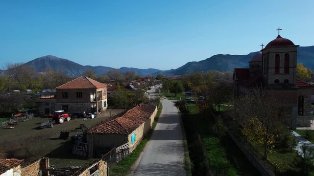 Exploring a Small Albanian Village: Scenic Balkan Countrylike Drone Footage of Church and Houses