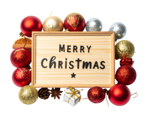 Festive arrangement with ornaments, a sign reading "Merry Christmas," and a small gift. It is a holiday celebration display