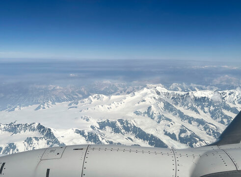 Mountains and clouds out a plane window
