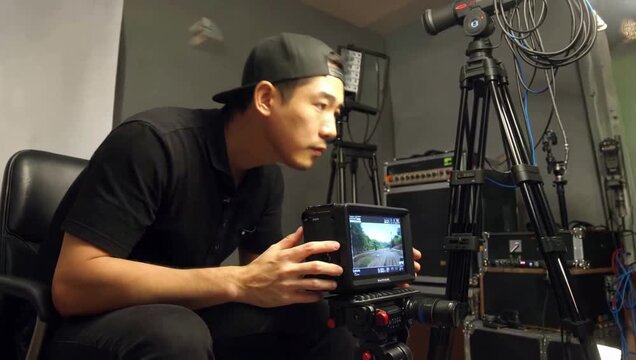 Man Reacting to Footage on Monitor, Indoor Studio