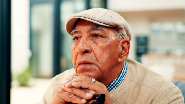 Sad, old man and thinking with walking stick in home for grief, retirement loneliness or nostalgia. Cane, reflection or senior person with depression on sofa for loss, unhappy memory or mental health - Powered by Adobe