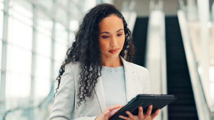 Tablet, reading and business woman in hotel lobby for email, online booking or conference schedule. Travel, technology or worker with app for notification, hospitality or reservation info for seminar