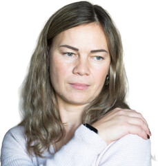 Pensive middle-aged woman with hand on shoulder, isolated on a clean white background. Perfect for cutouts, illustrating emotions like thoughtfulness, comfort, or mild concern. Ideal for health