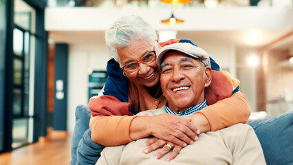 Sofa, hug and portrait of senior couple in home for bonding, connection and commitment. Retirement, marriage and mature man and woman embrace for affection, love and relationship on couch together