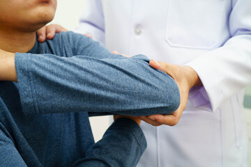 Physical therapy, Asian therapist doctor treat perform pain therapy in hospital.