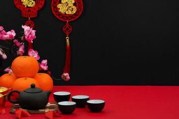 Background with Black and Red Decor for Lunar New Year Tea Ceremony