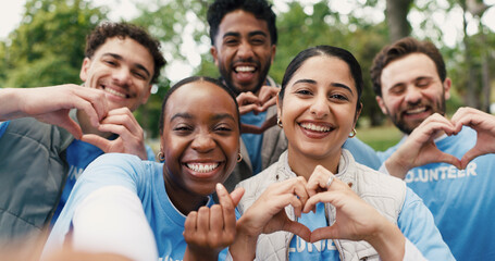 Volunteer team, people and selfie with heart hands for community service, support or laugh. Charity group, portrait or picture at park with finger gesture for care, NGO or social media with funny POV