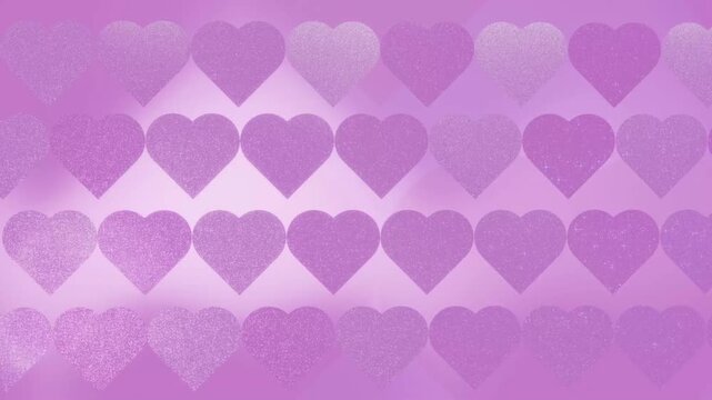A dreamy pink animation featuring glittery hearts swirling and shimmering under dynamic lighting, with rotating projections of varying sizes and shades of pink.