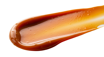 Glossy caramel cream smear silky warm sheen across white