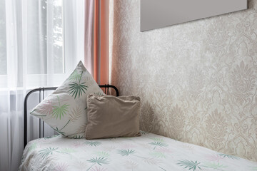 Cozy Bedroom Corner with Decorative Pillows and Soft Light