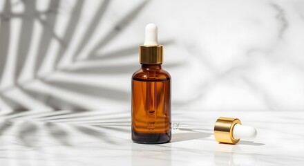 A bottle of facial serum with a dropper lying beside it.
