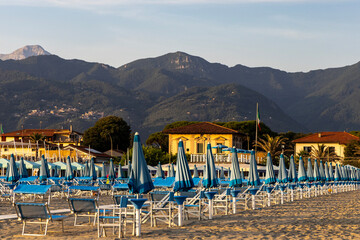 Beach tourist resort with sun loungers and parasols, Tyrrhenian Sea, Viareggio, Italy.