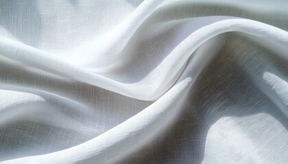 A close-up view of flowing white linen fabric, showcasing its textured weave and the interplay of light and shadow across its draped folds.