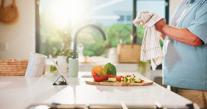 Drying hands, cloth and vegetables in kitchen for cooking, tablet and search online with flare at apartment. Person, organic produce and hygiene with tech, streaming or tutorial video on app at house - Powered by Adobe