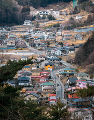 Colorful Japanese Hillside Town with Scenic Road — Aerial Style View”