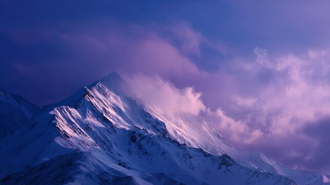 Majestic mountain peaks illuminated by twilight and covered in snow - Powered by Adobe