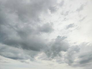 A sky filled with dense, dramatic gray clouds, suggesting an overcast day or impending rain, creating a moody and atmospheric backdrop..