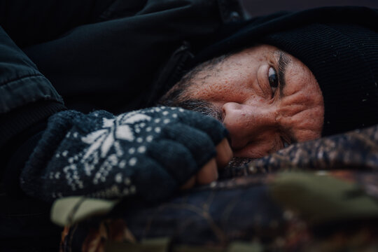 Homeless man struggling with poverty and winter cold