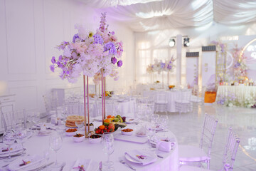 Stylish wedding table setting in a bright venue