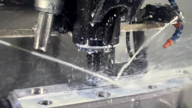 CNC milling machine cutting the mold parts with oil coolant method The mold and die manufacturing process by machining center with the solid ball endmill tools.