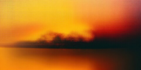 Abstract blurred sunset sky with orange and yellow gradient hues, soft warm light, and textured pattern background.